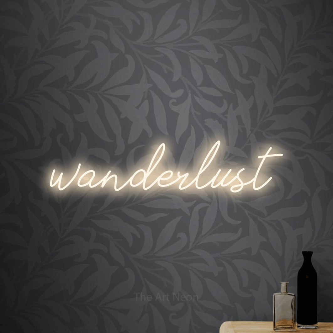 LED neon sign reading “wanderlust”, arranged in a single line.