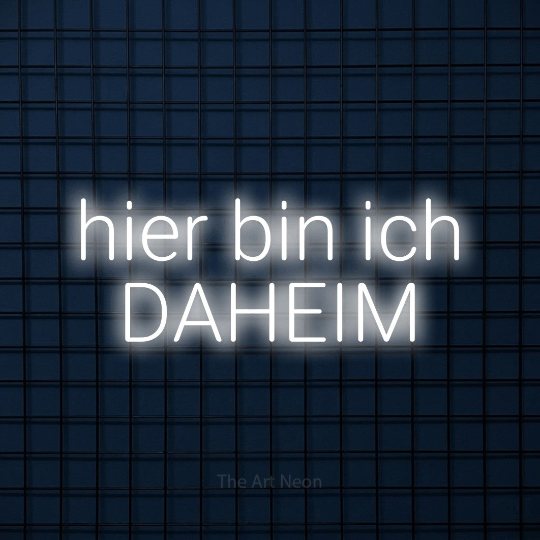 LED neon sign reading “hier bin ich DAHEIM”, arranged in 2 lines.