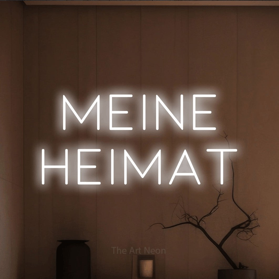 LED neon sign reading “meine heimat”, arranged in 2 lines.