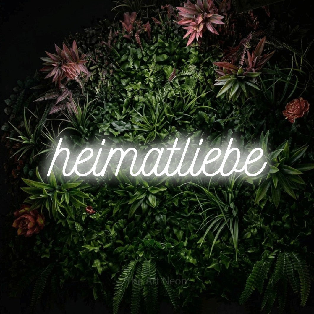 LED neon sign reading “heimatliebe”, arranged in a single line.