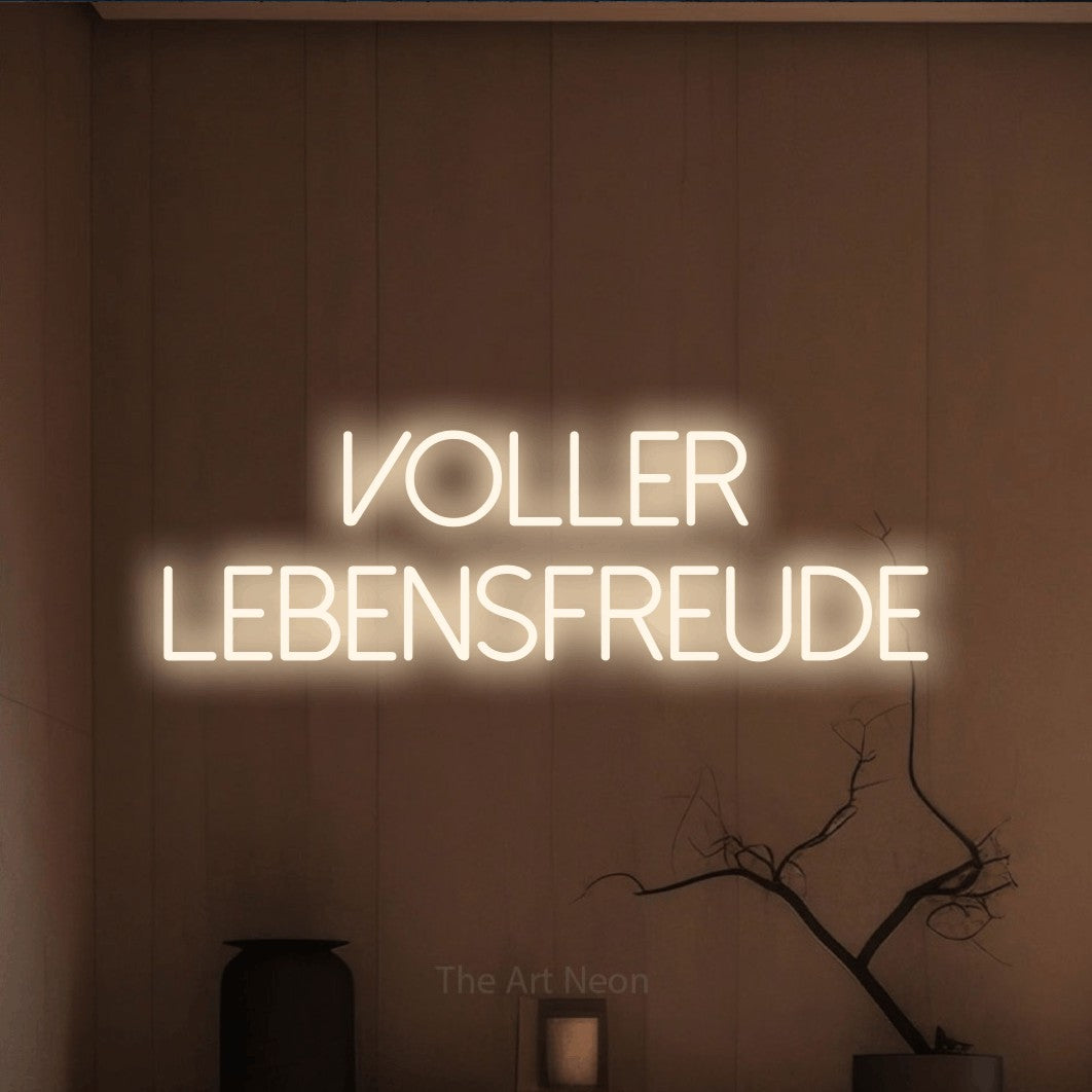 LED neon sign reading “Voller Lebensfreude”, arranged in 2 lines.