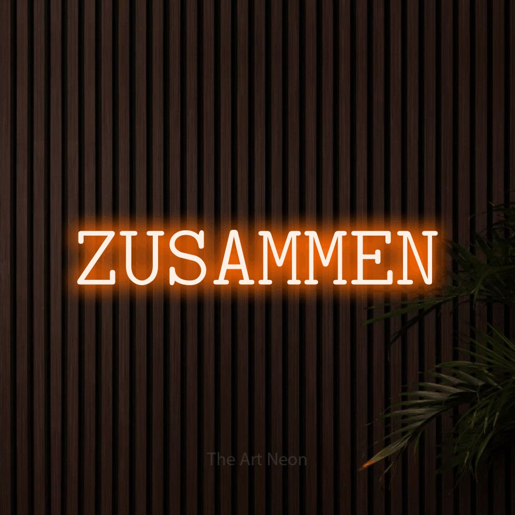 LED neon sign reading “ZUSAMMEN”, arranged in a single line.