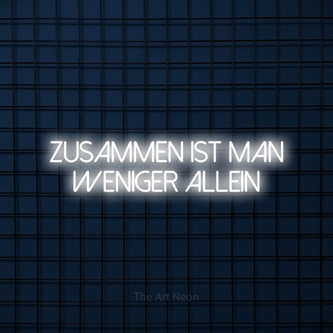 LED neon sign reading “Zusammen ist man weniger allein”, arranged in 2 lines.