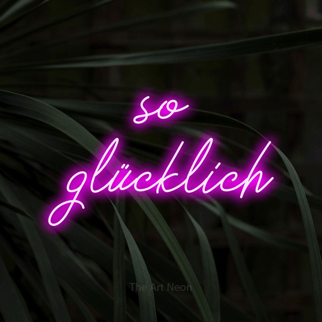 LED neon sign reading “so glücklich”, arranged in 2 lines.