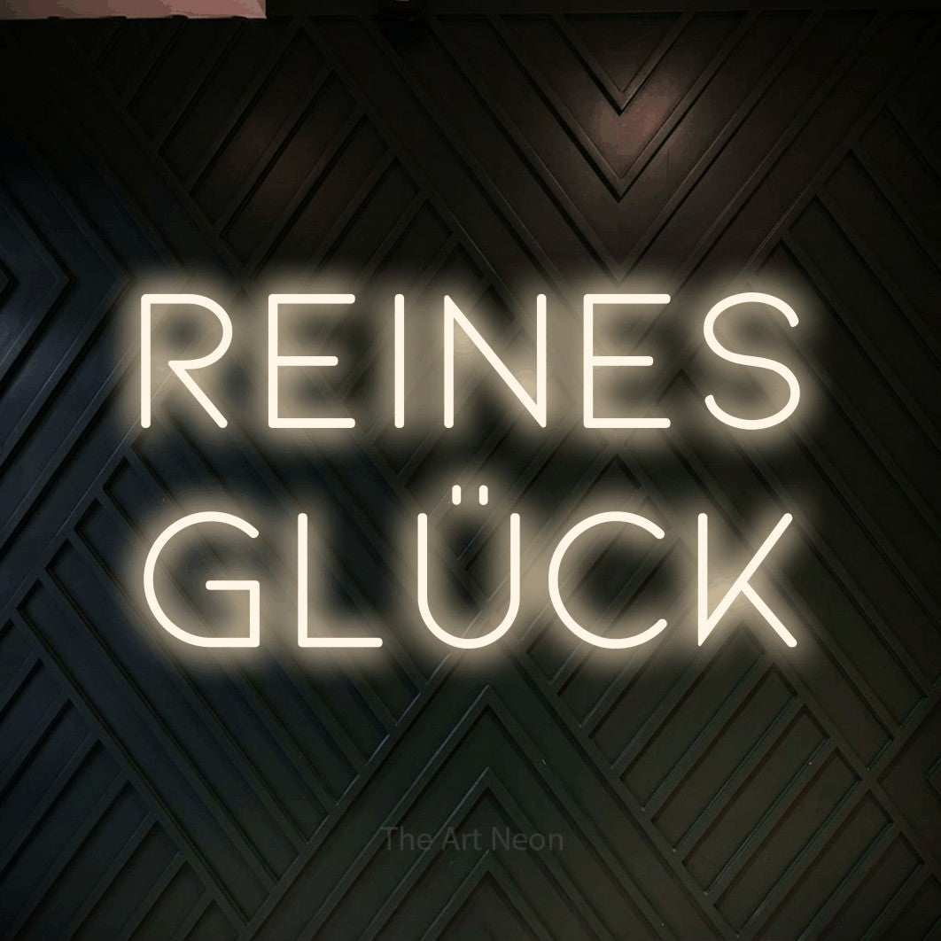 LED neon sign reading “reines glück”, arranged in 2 lines.