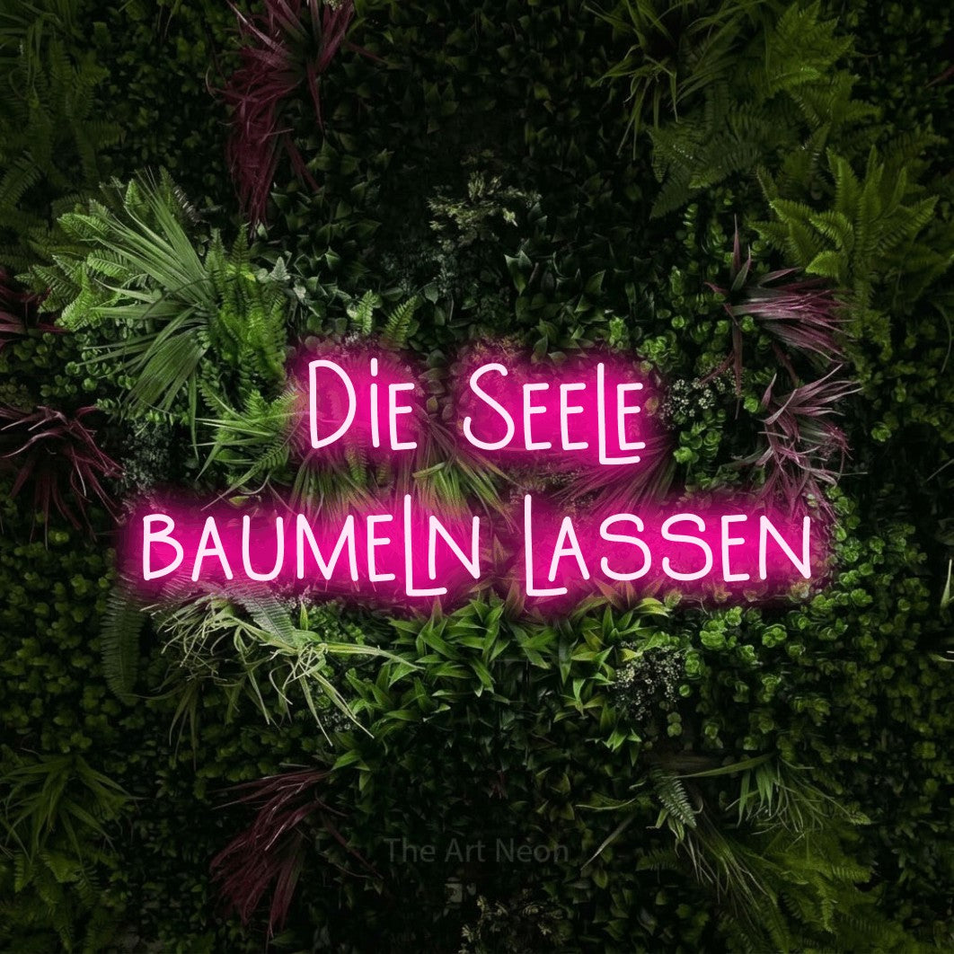 LED neon sign reading “Die Seele baumeln lassen”, arranged in 2 lines.