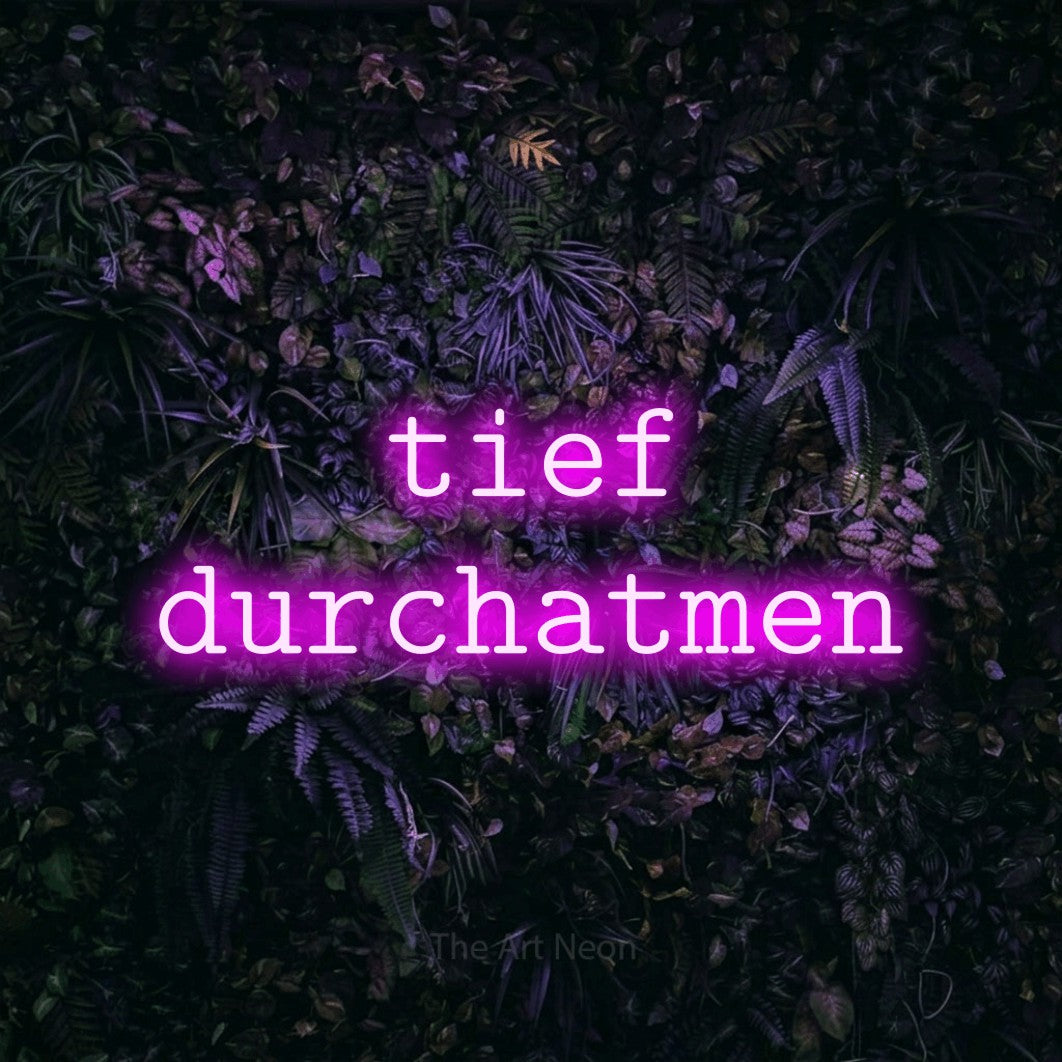 LED neon sign reading “tief durchatmen”, arranged in 2 lines.