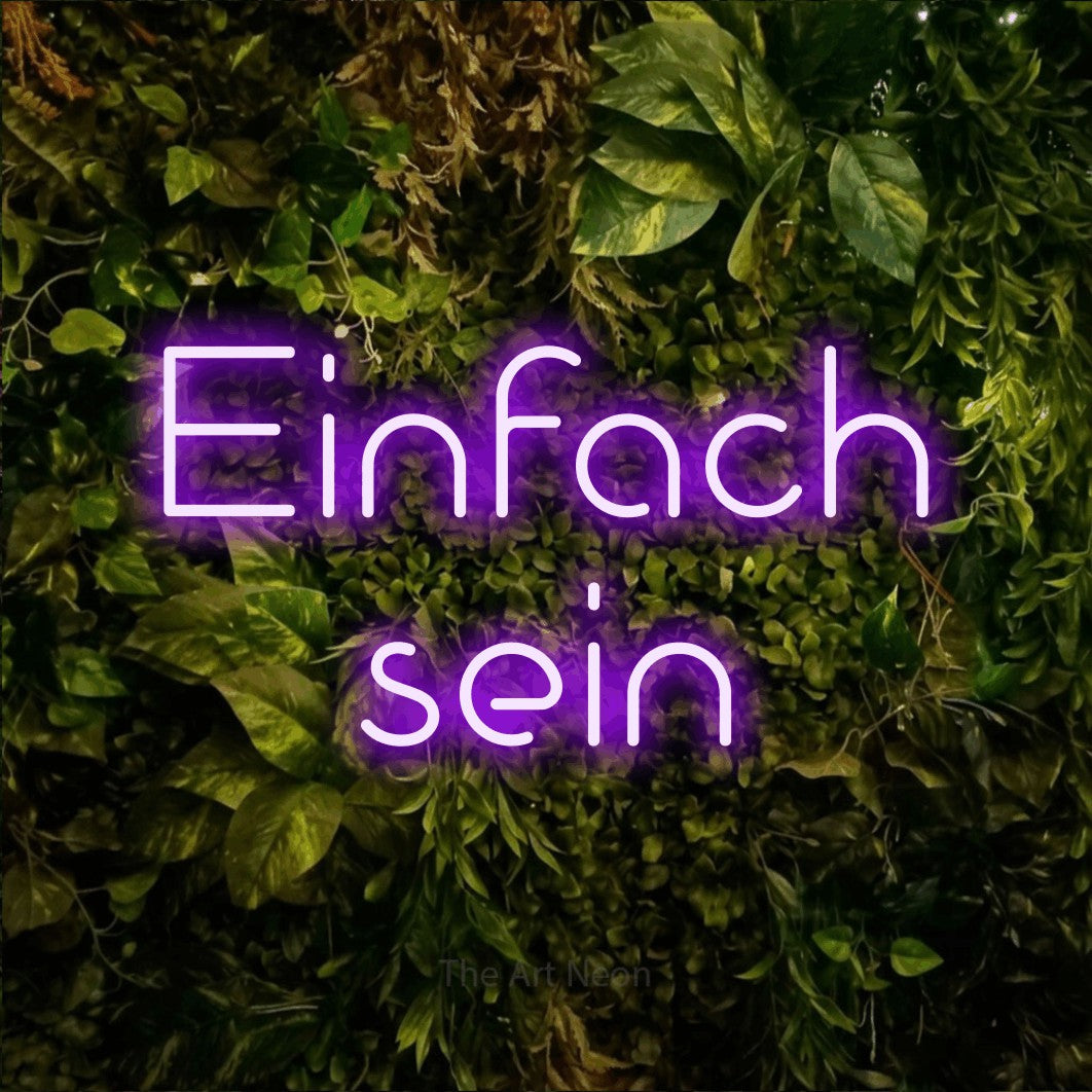 LED neon sign reading “Einfach sein”, arranged in 2 lines.