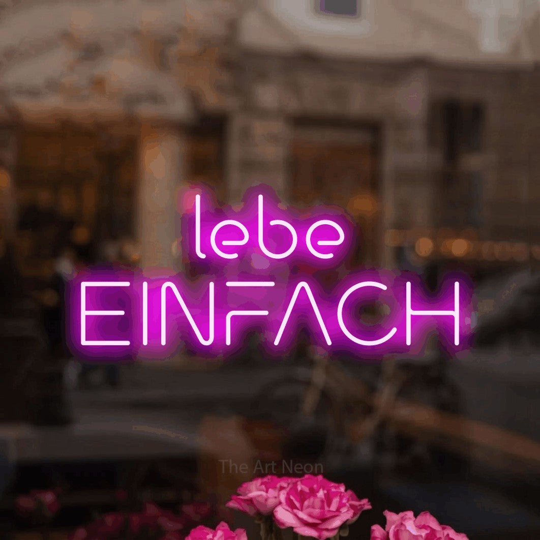 LED neon sign reading “lebe EINFACH”, arranged in 2 lines.
