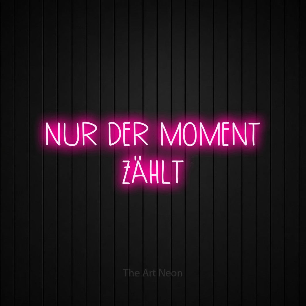 LED neon sign reading “NUR DER MOMENT ZÄHLT”, arranged in 2 lines.
