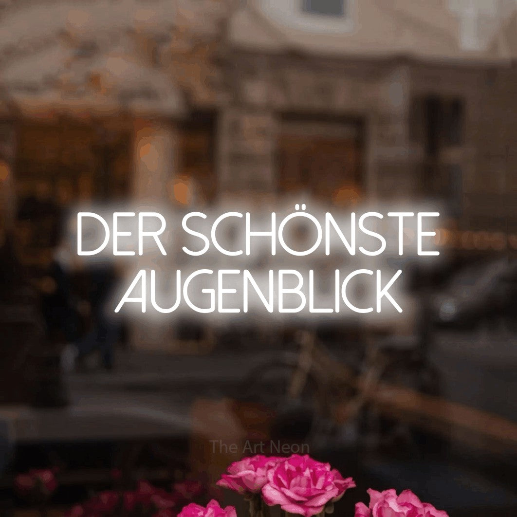 LED neon sign reading “der schönste augenblick”, arranged in 2 lines.