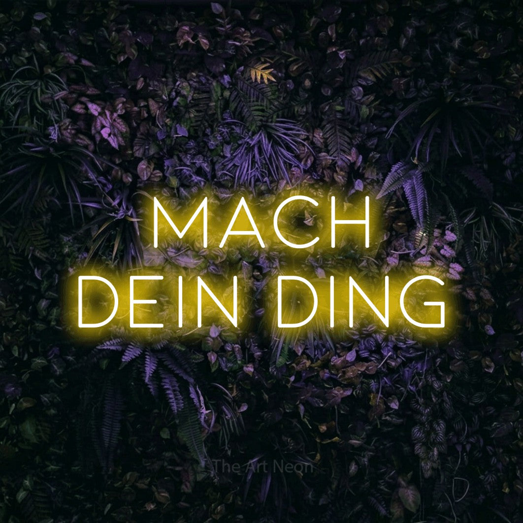 LED neon sign reading “MACH DEIN DING”, arranged in 2 lines.