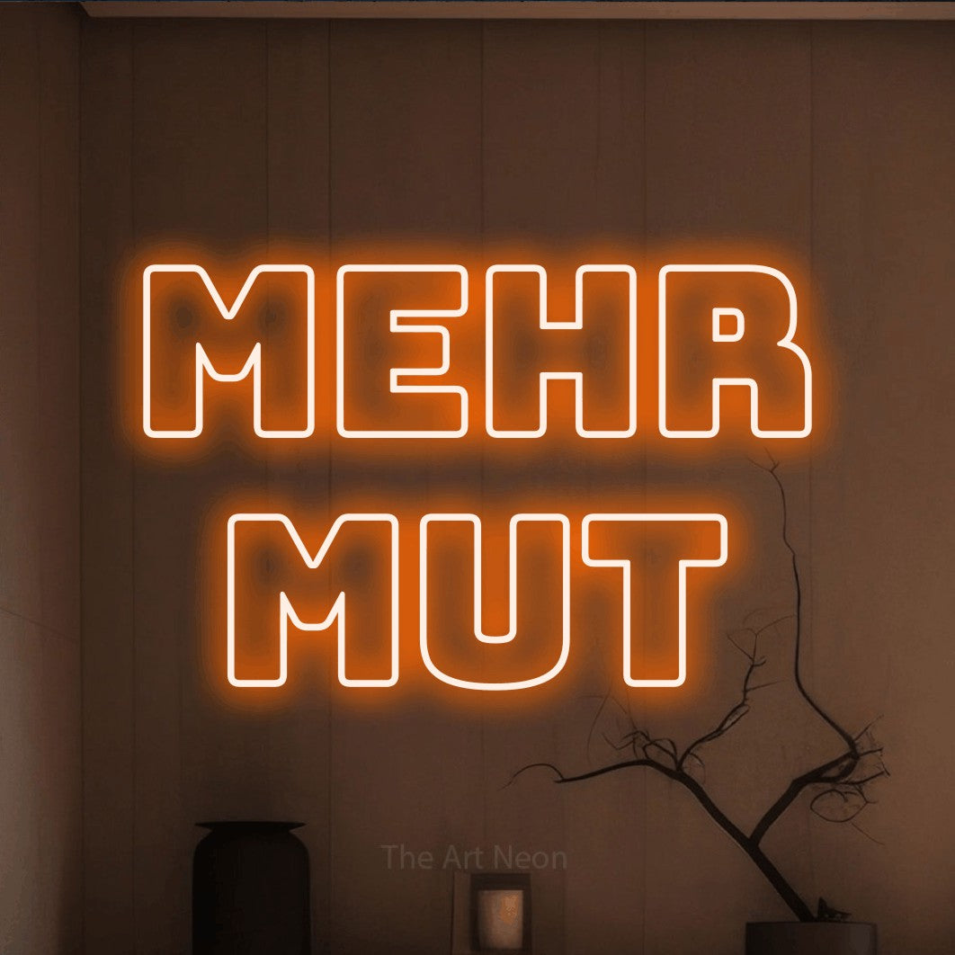 LED neon sign reading “mehr mut”, arranged in 2 lines.