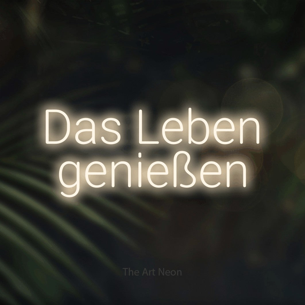 LED neon sign reading “Das Leben genießen”, arranged in 2 lines.