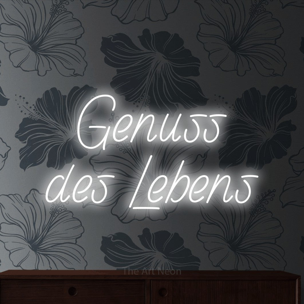 LED neon sign reading “Genuss des Lebens”, arranged in 2 lines.