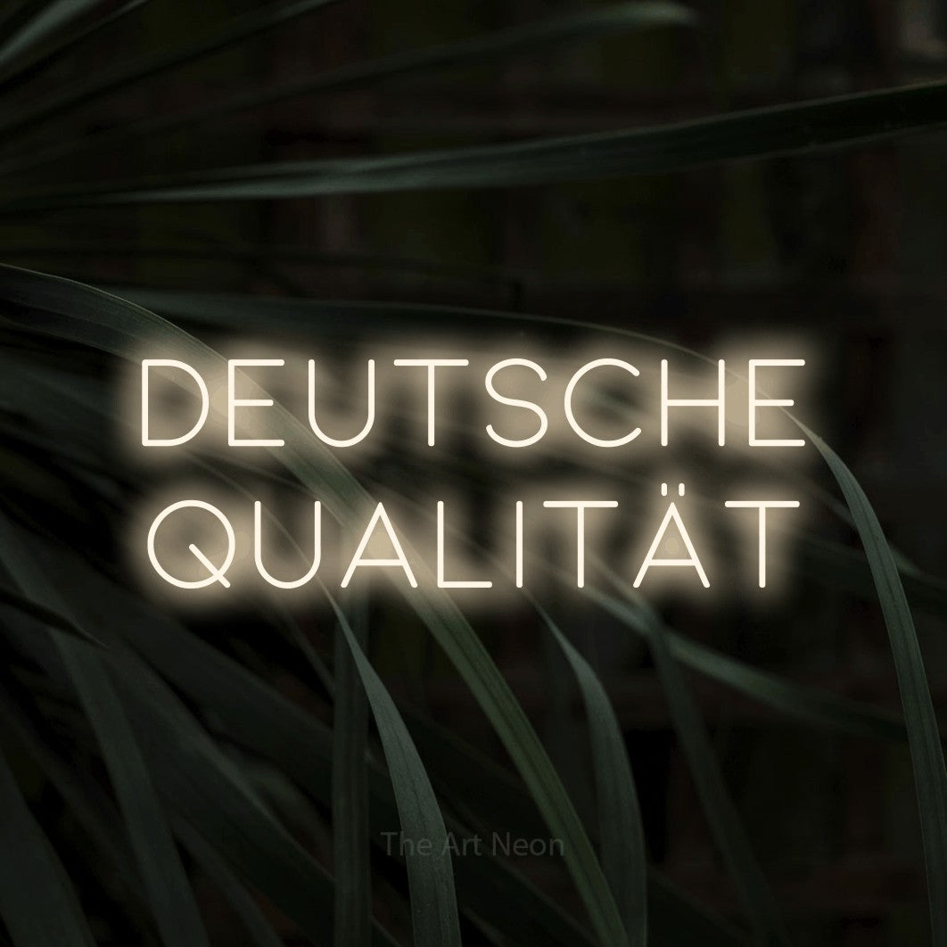 LED neon sign reading “DEUTSCHE QUALITÄT”, arranged in 2 lines.