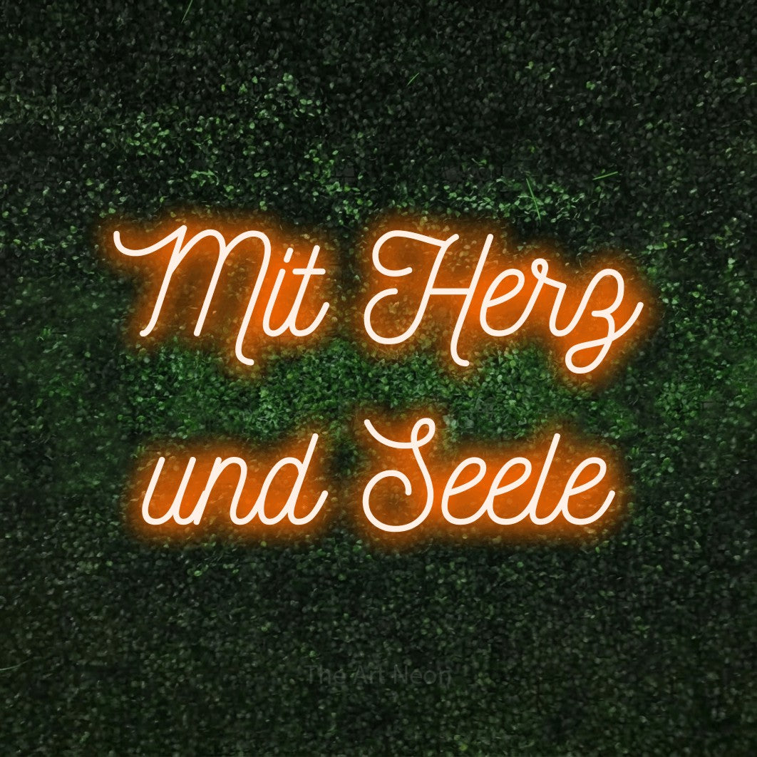 LED neon sign reading “Mit Herz und Seele”, arranged in 2 lines.