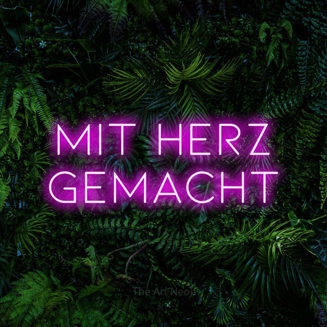 LED neon sign reading “Mit Herz gemacht”, arranged in 2 lines.