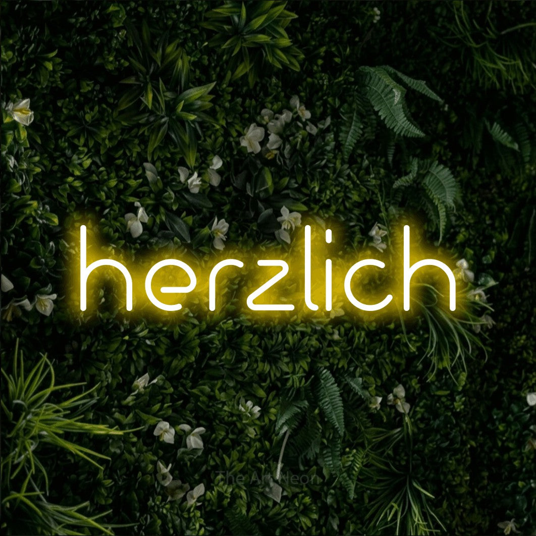 LED neon sign reading “herzlich”, arranged in a single line.
