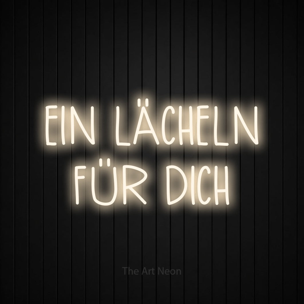 LED neon sign reading “EIN LÄCHELN FÜR DICH”, arranged in 2 lines.