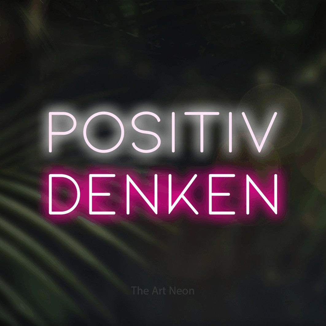 LED neon sign reading “POSITIV denken”, arranged in 2 lines.