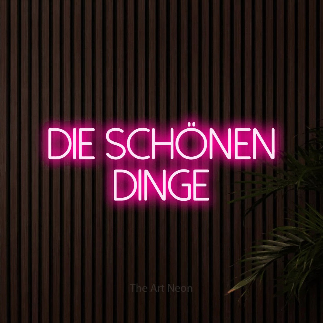 LED neon sign reading “Die schönen Dinge”, arranged in 2 lines.