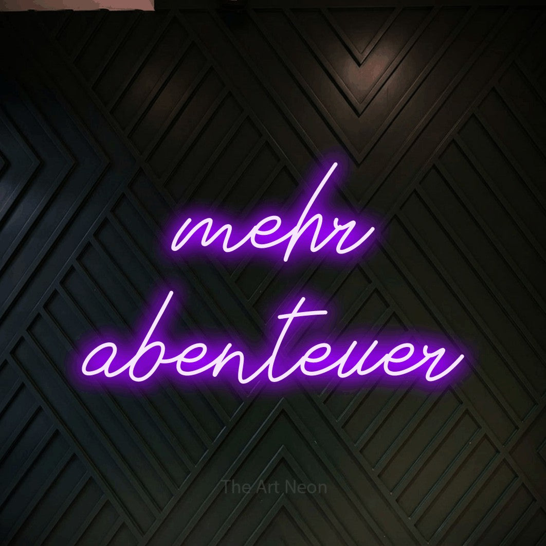 LED neon sign reading “mehr abenteuer”, arranged in 2 lines.