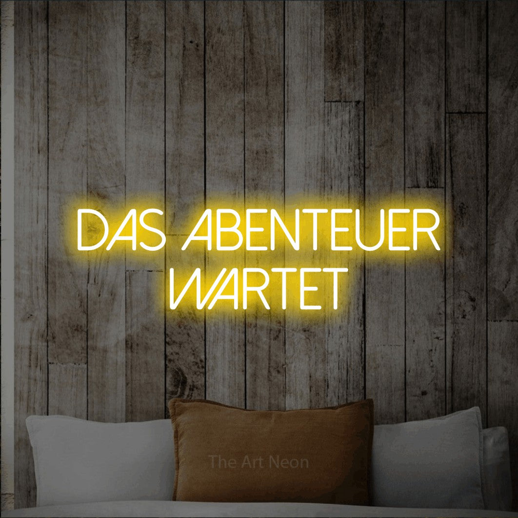 LED neon sign reading “Das Abenteuer wartet”, arranged in 2 lines.