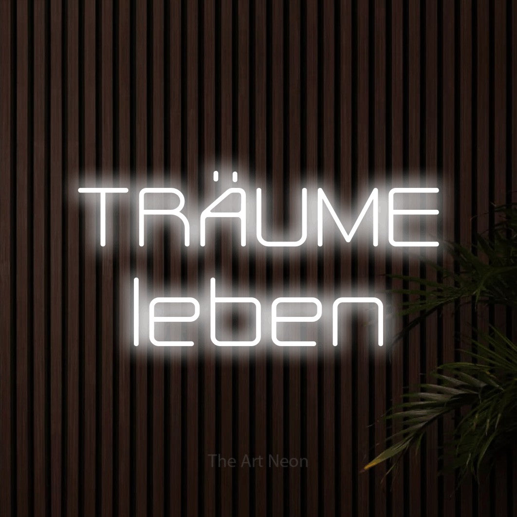 LED neon sign reading “TRÄUME leben”, arranged in 2 lines.