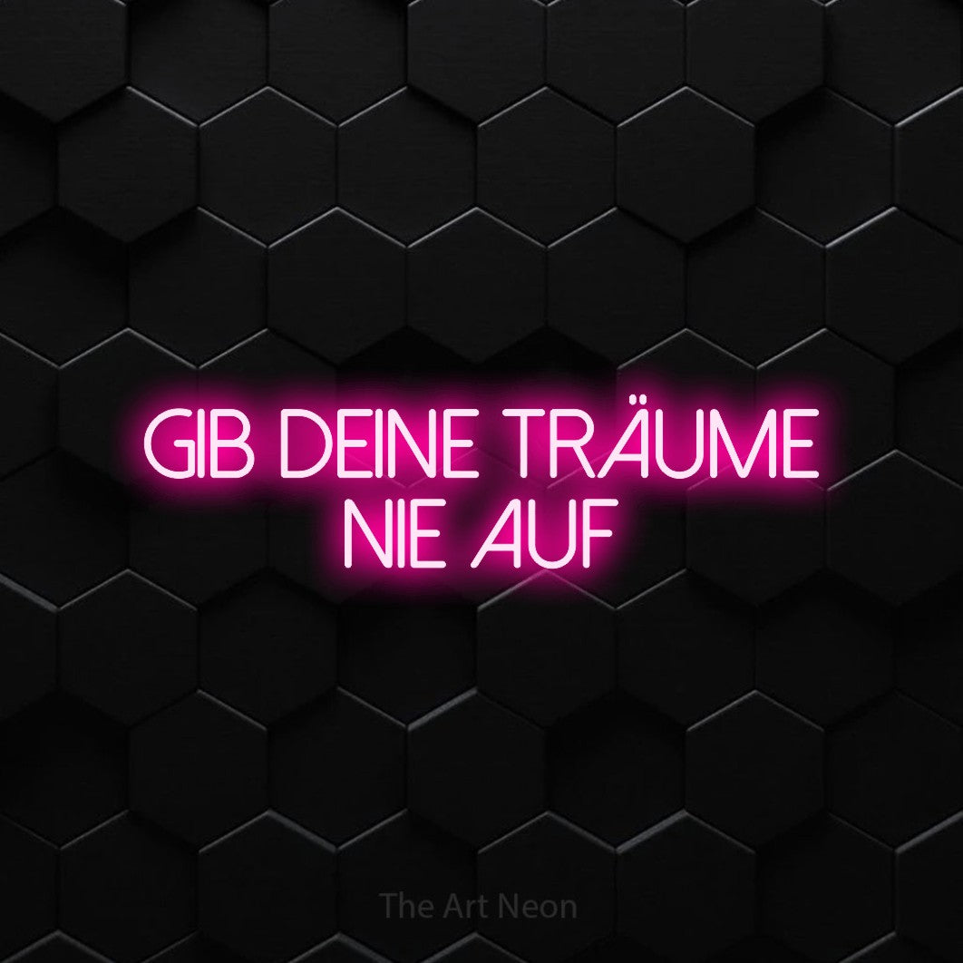 LED neon sign reading “Gib deine Träume nie auf”, arranged in 2 lines.