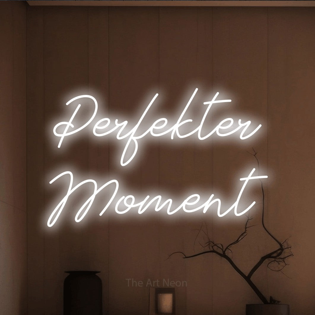 LED neon sign reading “Perfekter Moment”, arranged in 2 lines.