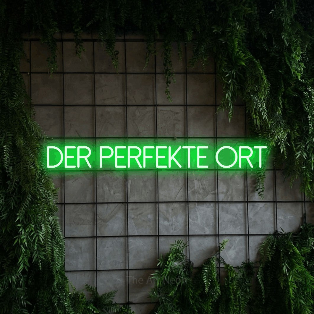 LED neon sign reading “Der perfekte Ort”, arranged in a single line.