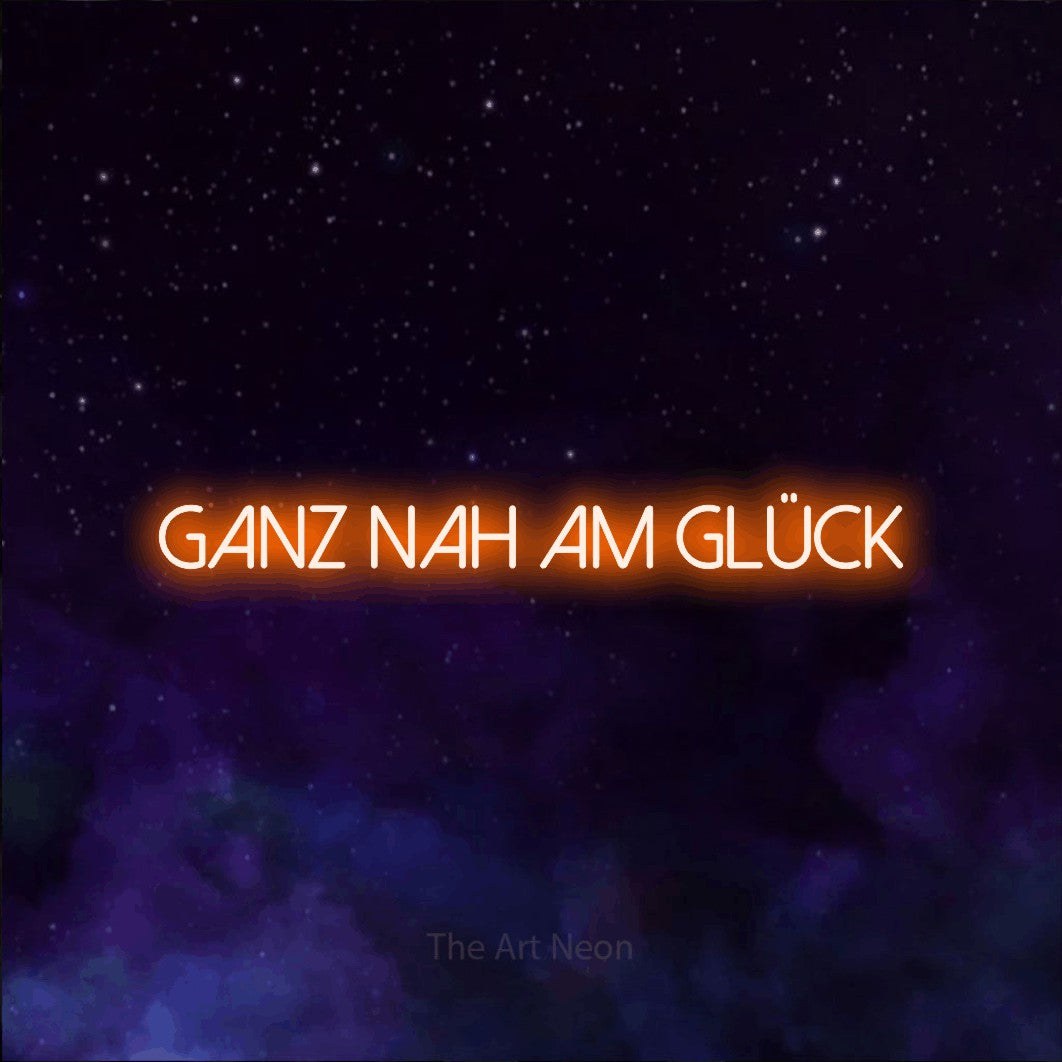 LED neon sign reading “GANZ NAH AM GLÜCK”, arranged in a single line.