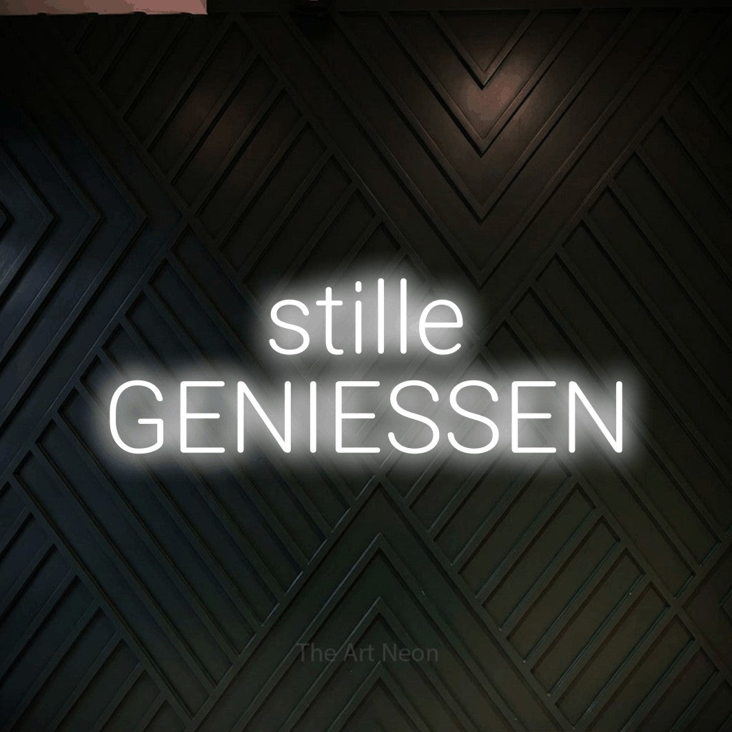 LED neon sign reading “stille GENIESSEN”, arranged in 2 lines.