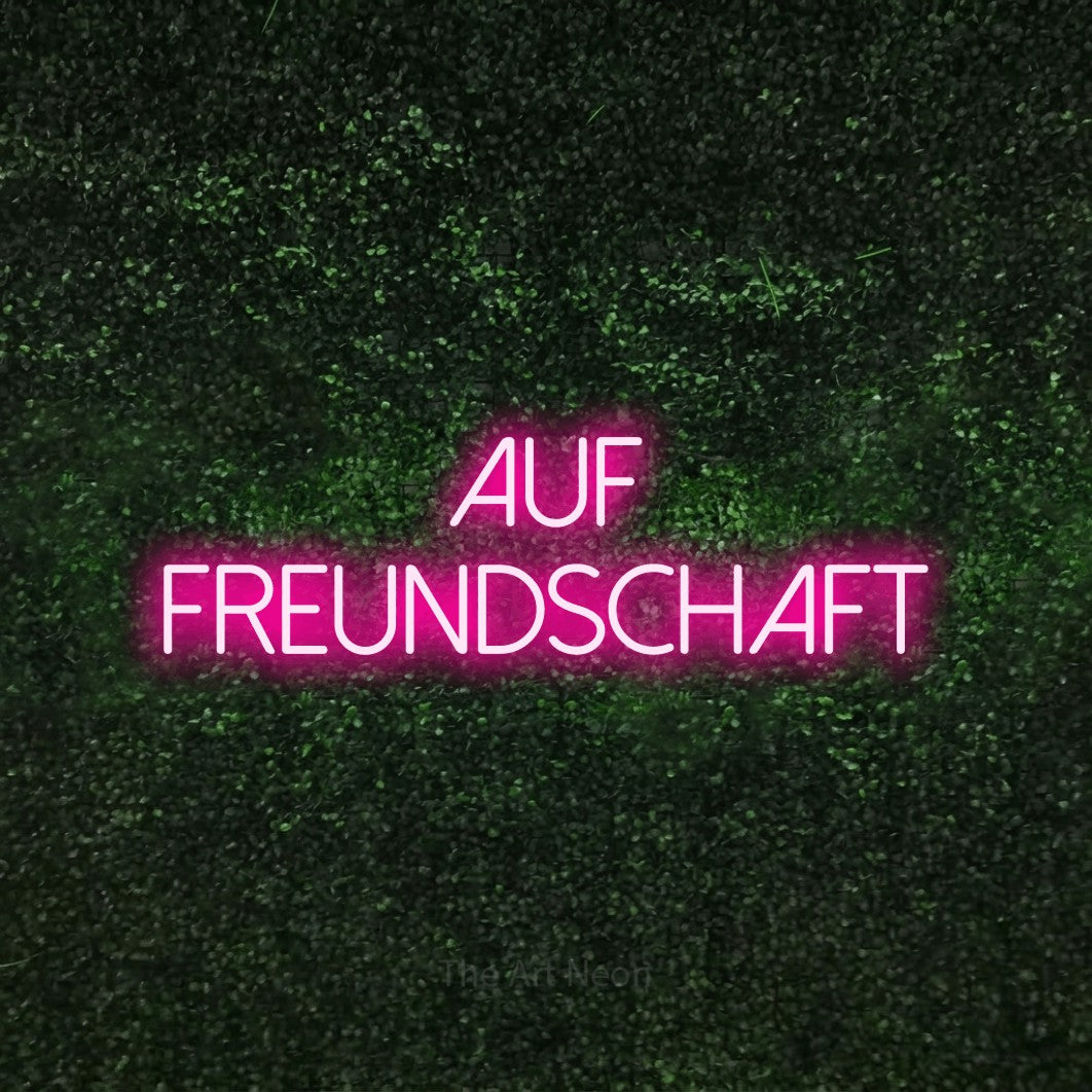 LED neon sign reading “auf FREUNDSCHAFT”, arranged in 2 lines.
