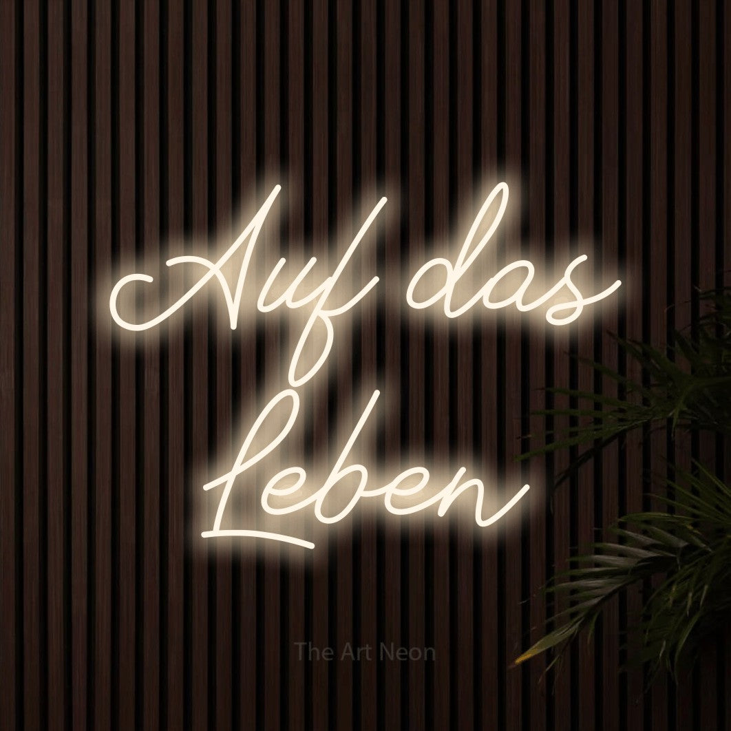 LED neon sign reading “Auf das Leben”, arranged in 2 lines.