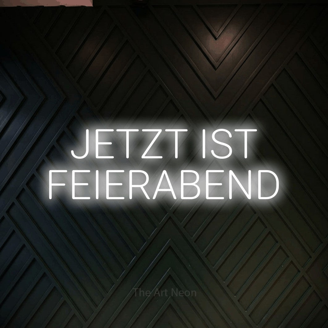 LED neon sign displaying “JETZT IST FEIERABEND”.