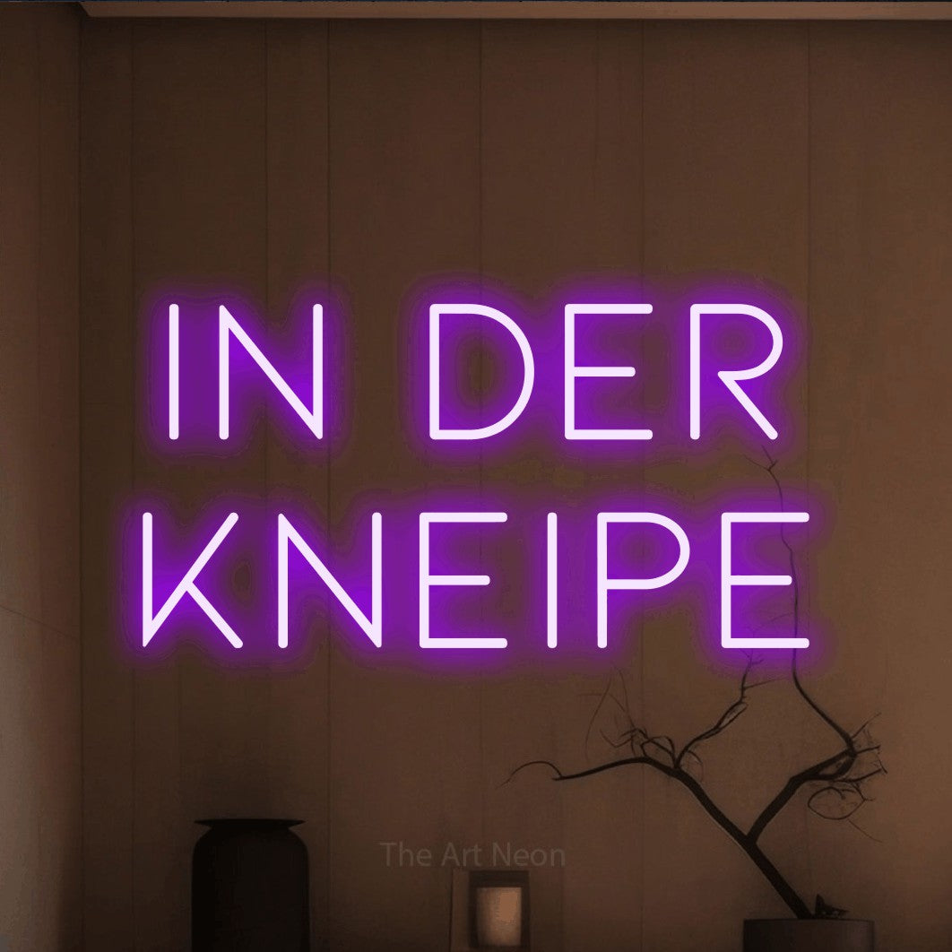 LED neon sign reading “in der kneipe”, arranged in 2 lines.