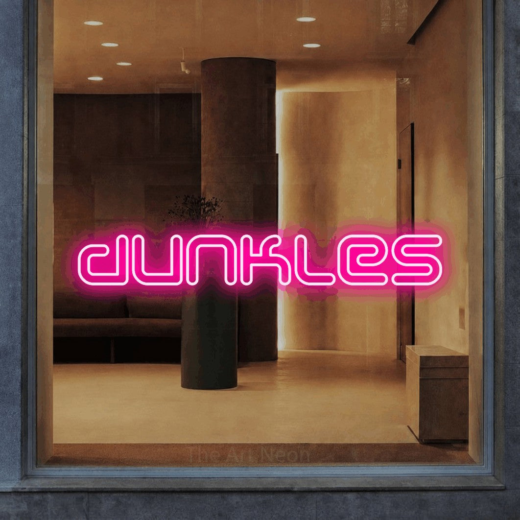 LED neon sign reading “dunkles”, arranged in a single line.
