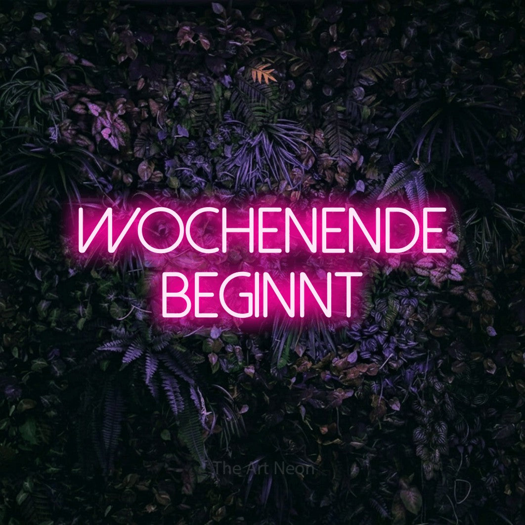 LED neon sign reading “WOCHENENDE BEGINNT”, arranged in 2 lines.