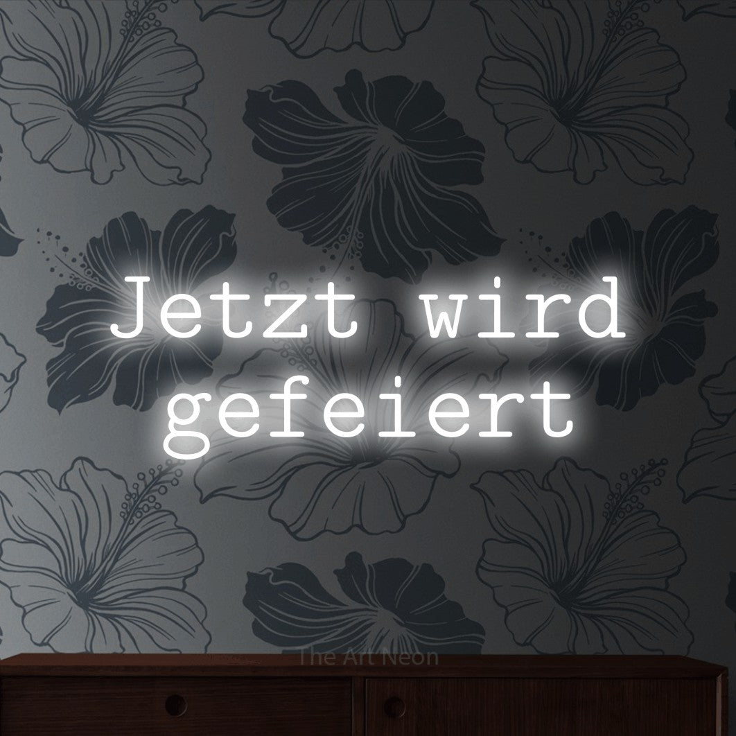 LED neon sign reading “Jetzt wird gefeiert”, arranged in 2 lines.