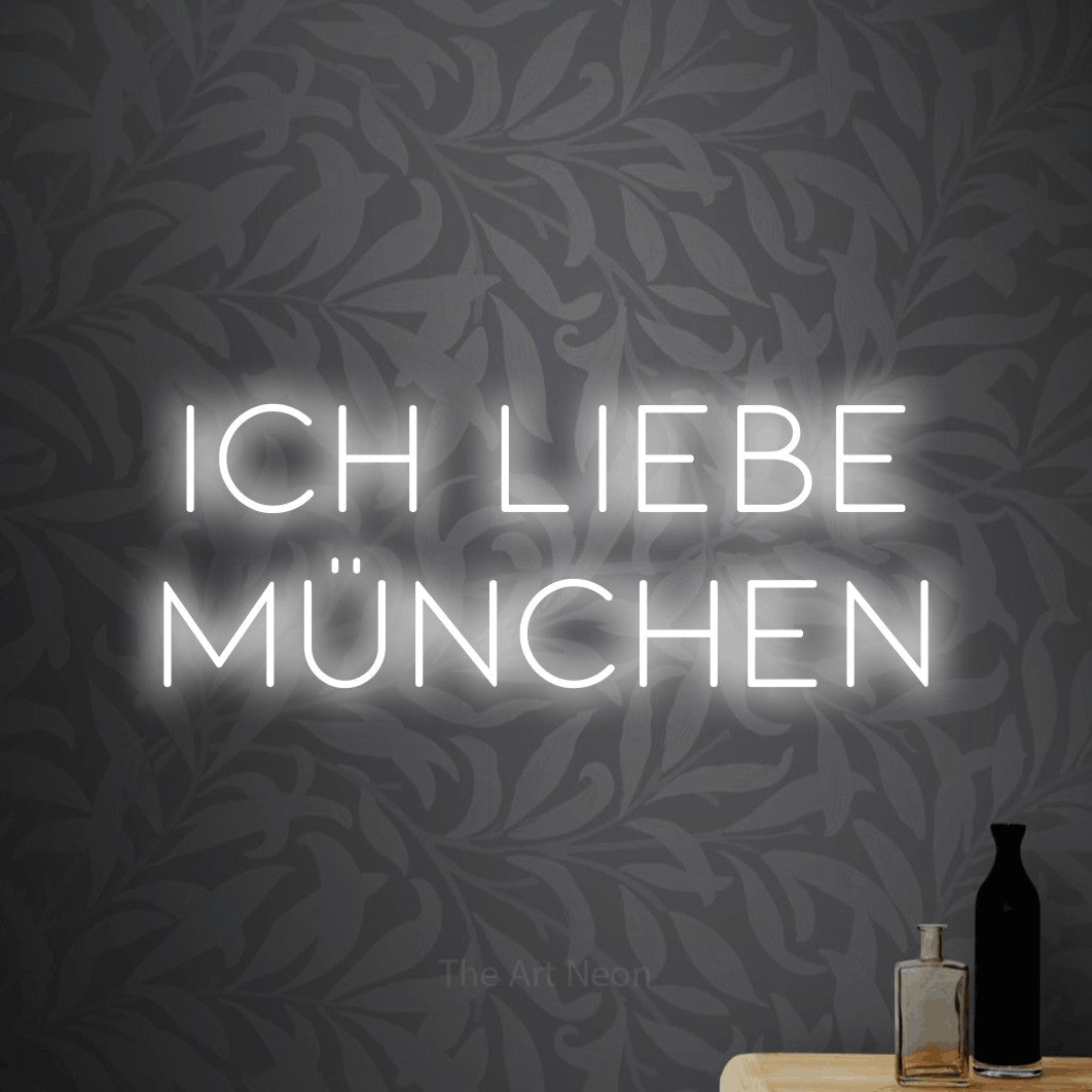 LED neon sign reading “Ich liebe München”, arranged in 2 lines.