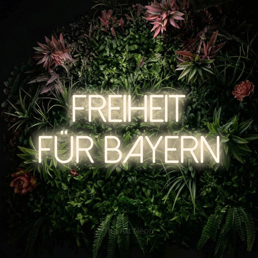 LED neon sign reading “Freiheit für Bayern”, arranged in 2 lines.