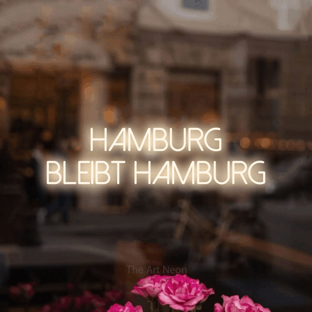 LED neon sign reading “Hamburg bleibt Hamburg”, arranged in 2 lines.