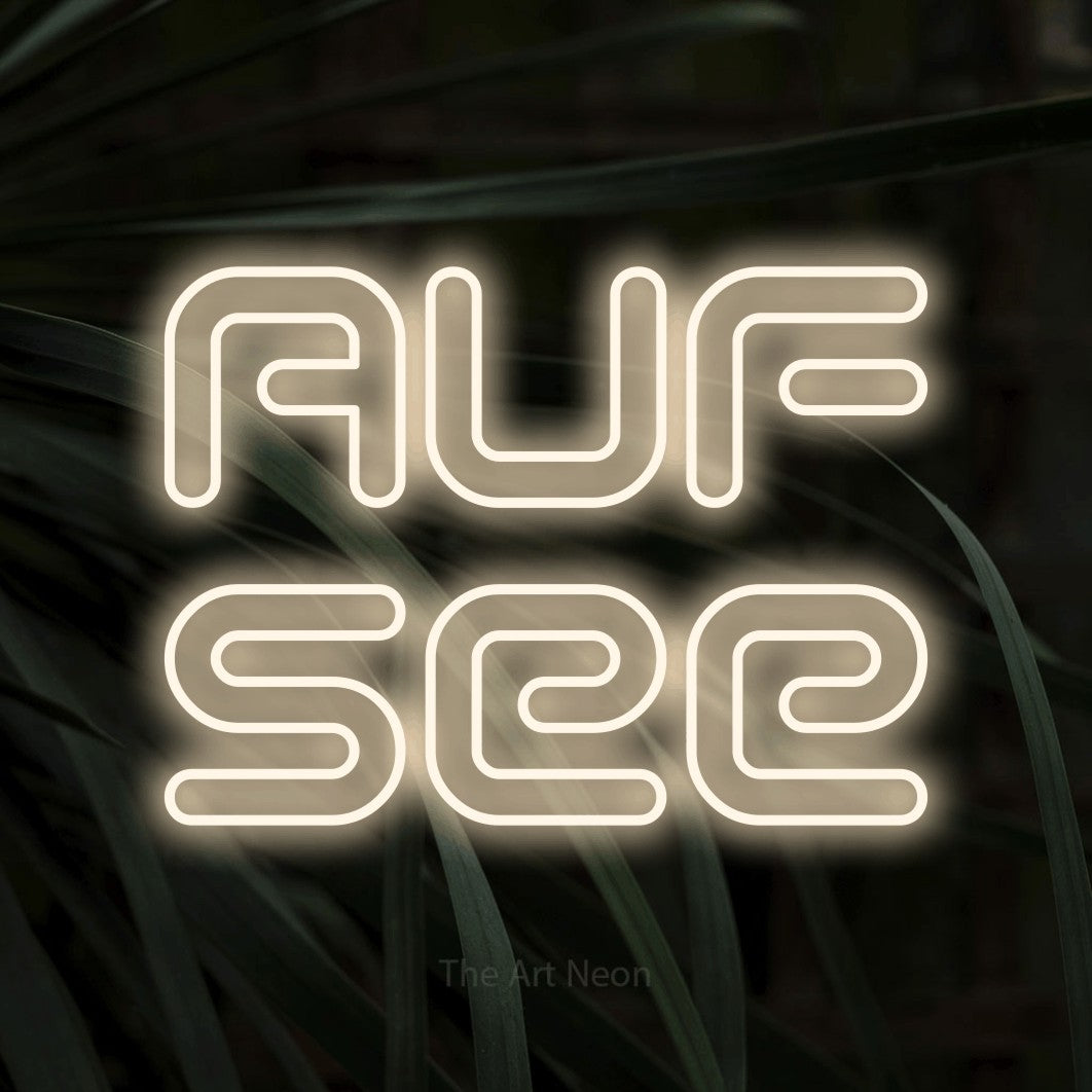 LED neon sign reading “AUF see”, arranged in 2 lines.