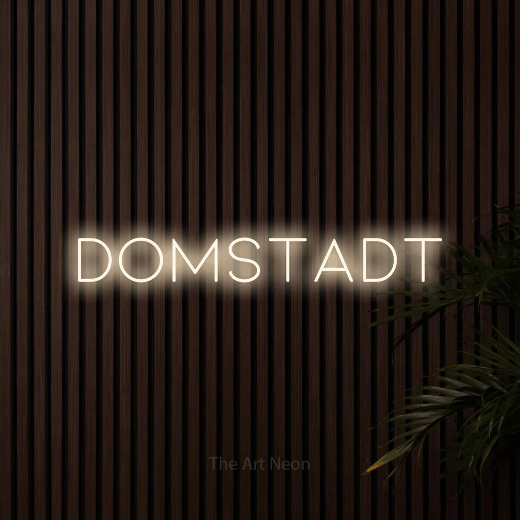 LED neon sign reading “Domstadt”, arranged in a single line.