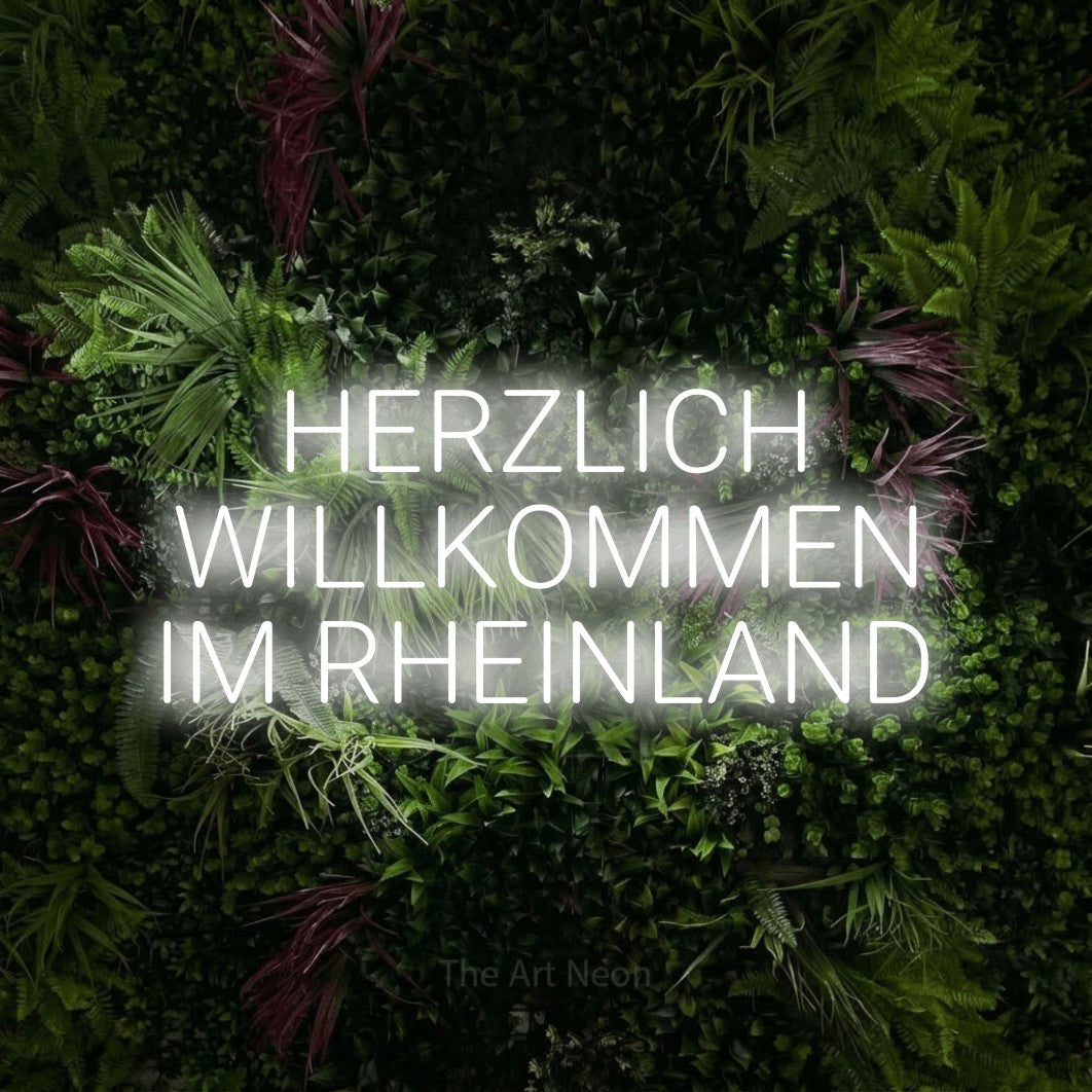 LED neon sign reading “HERZLICH WILLKOMMEN IM RHEINLAND”, arranged in 3 lines.
