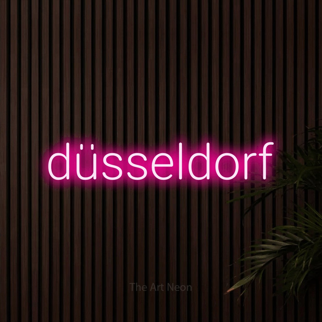 LED neon sign reading “düsseldorf”, arranged in a single line.