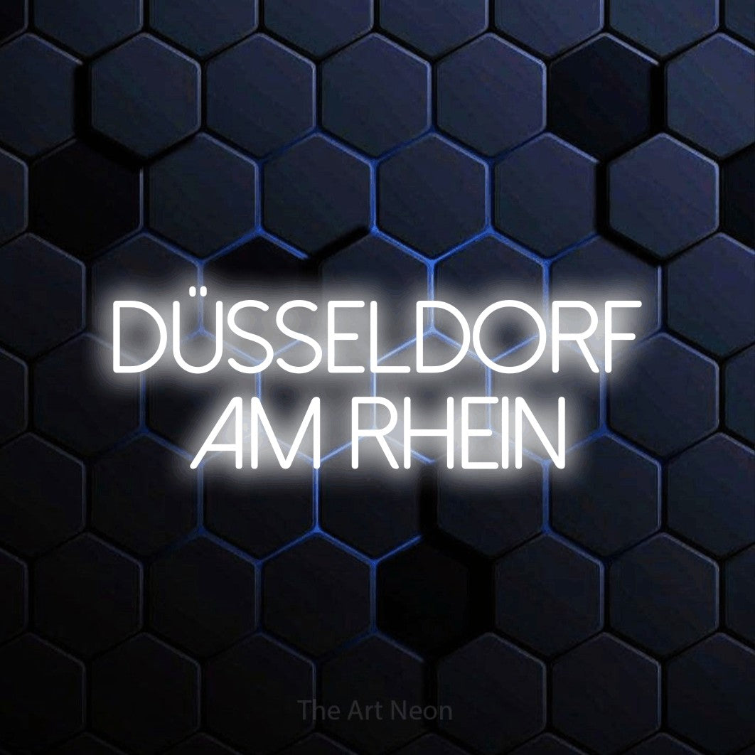LED neon sign reading “DÜSSELDORF am rhein”, arranged in 2 lines.