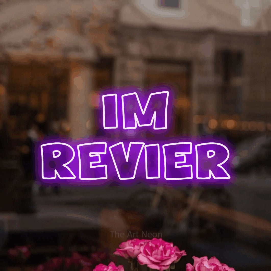 LED neon sign reading “Im Revier”, arranged in 2 lines.